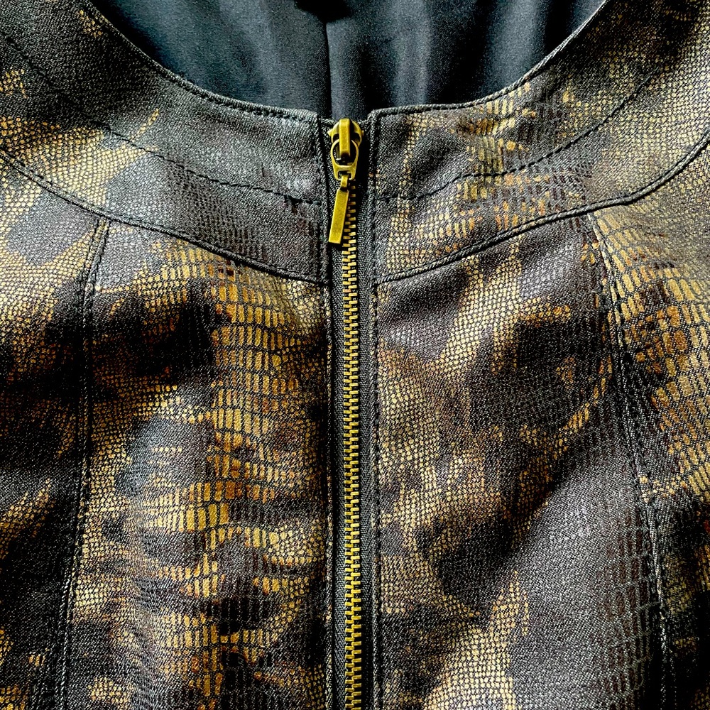 Bomber jacket. Brown and black. Rayon and polyester blend. Fitted.